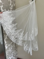 Heavily lace edged veil 